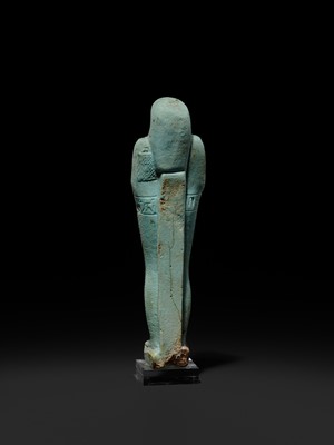 Lot 56 - A SUPERB PALE BLUE FAIENCE SHABTI OF NESBANEBDJED, DYNASTY XXX