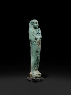 Lot 56 - A SUPERB PALE BLUE FAIENCE SHABTI OF NESBANEBDJED, DYNASTY XXX