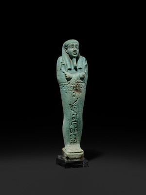 Lot 56 - A SUPERB PALE BLUE FAIENCE SHABTI OF NESBANEBDJED, DYNASTY XXX