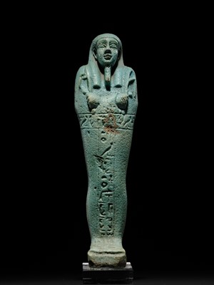 Lot 56 - A SUPERB PALE BLUE FAIENCE SHABTI OF NESBANEBDJED, DYNASTY XXX