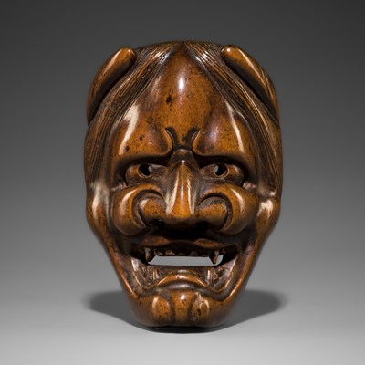 A LARGE WOOD MASK NETSUKE OF HANNYA