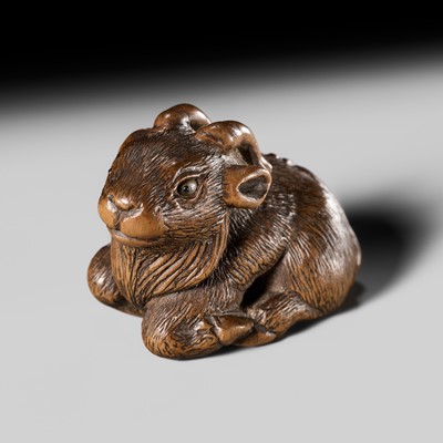 Lot 206 - MINKO: A FINE WOOD NETSUKE OF A RECUMBENT GOAT