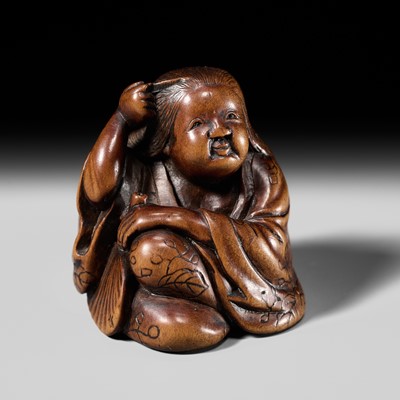 Lot 228 - ISSAI: A FINE NAGOYA SCHOOL WOOD NETSUKE OF OKAME BRUSHING HER HAIR