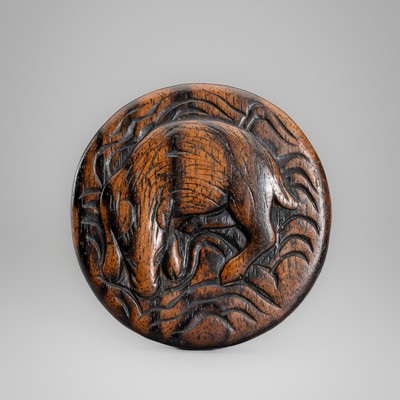 A WOOD MANJU NETSUKE DEPICTING A BOAR