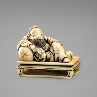 A FINE IVORY NETSUKE OF SOSHI DREAMING