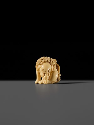 Lot 101 - A FINE IVORY NETSUKE OF A SEATED BAKU