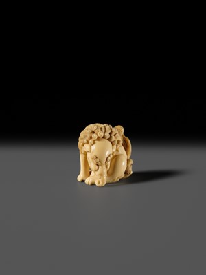 Lot 101 - A FINE IVORY NETSUKE OF A SEATED BAKU