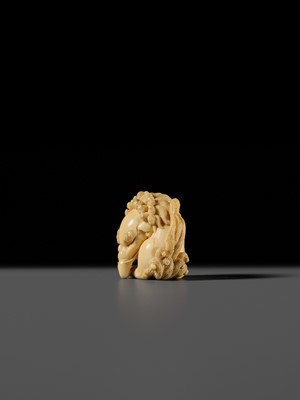 Lot 101 - A FINE IVORY NETSUKE OF A SEATED BAKU