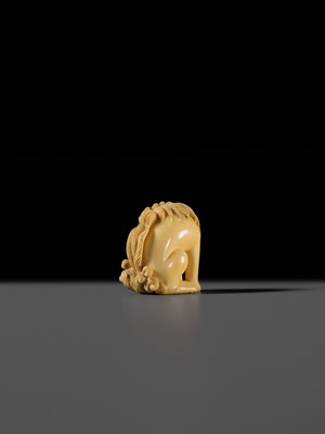 Lot 101 - A FINE IVORY NETSUKE OF A SEATED BAKU