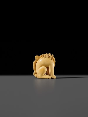 Lot 101 - A FINE IVORY NETSUKE OF A SEATED BAKU