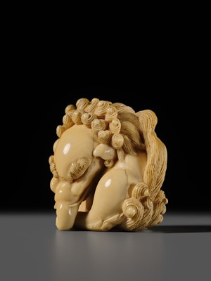 Lot 101 - A FINE IVORY NETSUKE OF A SEATED BAKU