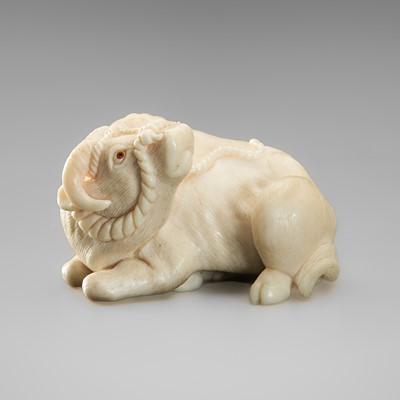 Lot 330 - KAIGYOKU: A SUPERB IVORY NETSUKE OF A RECUMBENT OX