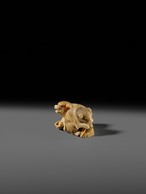 Lot 121 - OKATOMO: A CHARMING IVORY NETSUKE OF TWO PUPPIES WITH AWABI