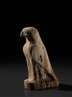 Lot 18 - A PAINTED WOOD FIGURE OF A FALCON, THE EMBODIMENT OF HORUS, LATE PERIOD TO PTOLEMAIC ERA