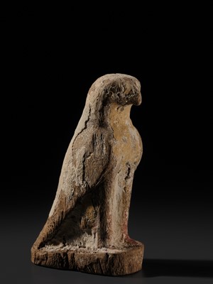 Lot 18 - A PAINTED WOOD FIGURE OF A FALCON, THE EMBODIMENT OF HORUS, LATE PERIOD TO PTOLEMAIC ERA