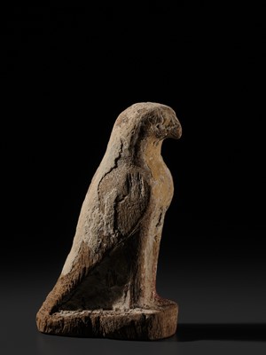 Lot 18 - A PAINTED WOOD FIGURE OF A FALCON, THE EMBODIMENT OF HORUS, LATE PERIOD TO PTOLEMAIC ERA