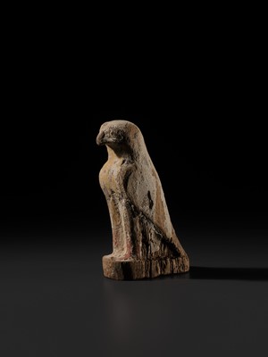 Lot 18 - A PAINTED WOOD FIGURE OF A FALCON, THE EMBODIMENT OF HORUS, LATE PERIOD TO PTOLEMAIC ERA