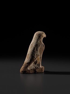 Lot 18 - A PAINTED WOOD FIGURE OF A FALCON, THE EMBODIMENT OF HORUS, LATE PERIOD TO PTOLEMAIC ERA