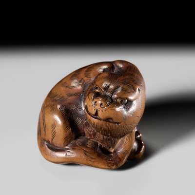 Lot 200 - MASANAO: A WOOD NETSUKE OF A TIGER