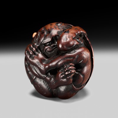 Lot 212 - KAZUYUKI: A FINE WOOD NETSUKE OF A COWERING ONI DURING SETSUBUN