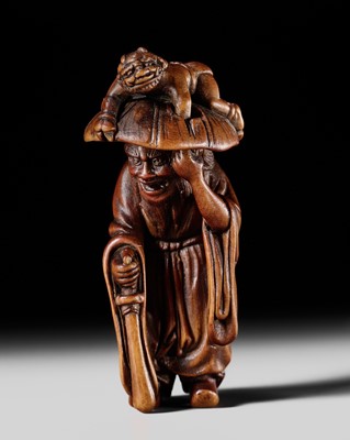 Lot 131 - HIDEMASA: A POWERFUL WOOD NETSUKE OF SHOKI AND ONI