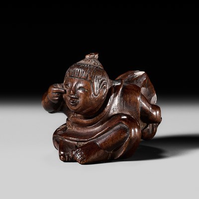Lot 236 - MIWA: A FINE INLAID WOOD NETSUKE OF A BOY WITH A HOZUKI (WINTER CHERRY)
