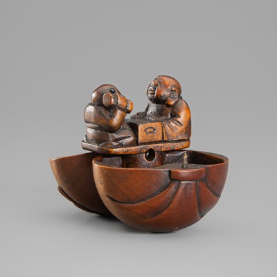 Lot 420 - SHUGETSU: A FINE WOOD KARAKURI (TRICK) NETSUKE OF HOTEI AND A KARAKO PLAYING GO INSIDE HOTEI’S TREASURE SACK