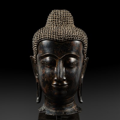 Lot 644 - A LARGE AND IMPRESSIVE BRONZE HEAD OF BUDDHA SHAKYAMUNI, AYUTTHAYA KINGDOM, CIRCA 1500
