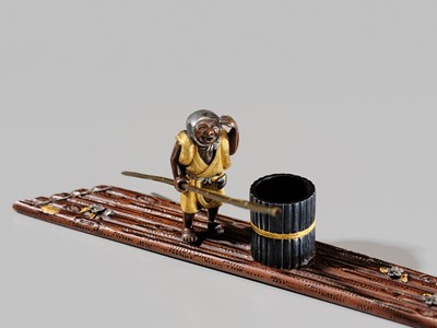 Lot 40 - SHOZUI: A FINE HAMANO SCHOOL MIXED-METAL BUNCHIN (PAPERWEIGHT) OF A FISHERMAN ON A FLOAT
