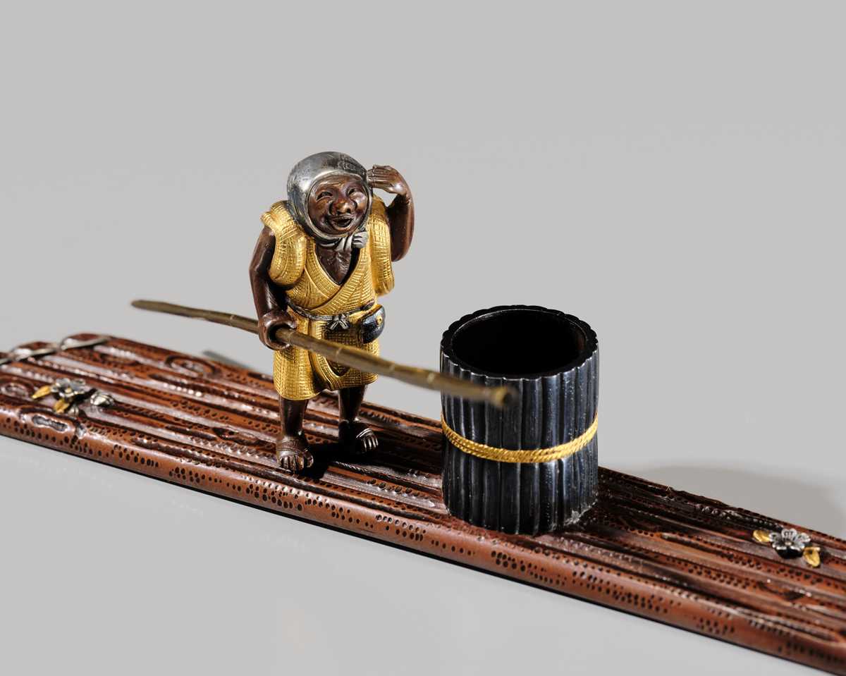 Lot 40 - SHOZUI: A FINE HAMANO SCHOOL MIXED-METAL BUNCHIN (PAPERWEIGHT) OF A FISHERMAN ON A FLOAT