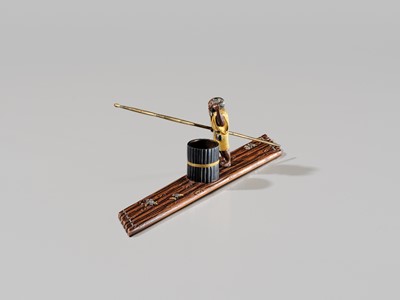 Lot 40 - SHOZUI: A FINE HAMANO SCHOOL MIXED-METAL BUNCHIN (PAPERWEIGHT) OF A FISHERMAN ON A FLOAT