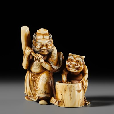 Lot 267 - HOJITSU: A SUPERB AND AMUSING IVORY NETSUKE OF SHOKI AND ONI POUNDING MOCHI