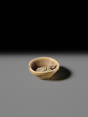 OHARA MITSUHIRO: A SUPERB IVORY NETSUKE OF A SEA BREAM HEAD IN A SURIBACHI (MORTAR), DATED 1855