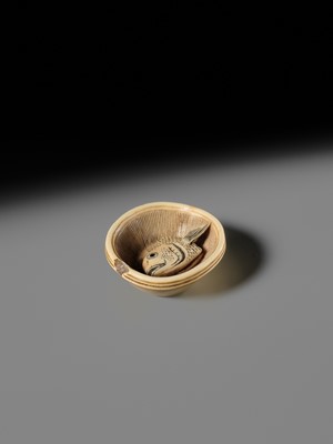OHARA MITSUHIRO: A SUPERB IVORY NETSUKE OF A SEA BREAM HEAD IN A SURIBACHI (MORTAR), DATED 1855