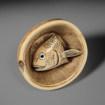 OHARA MITSUHIRO: A SUPERB IVORY NETSUKE OF A SEA BREAM HEAD IN A SURIBACHI (MORTAR), DATED 1855