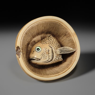 OHARA MITSUHIRO: A SUPERB IVORY NETSUKE OF A SEA BREAM HEAD IN A SURIBACHI (MORTAR), DATED 1855