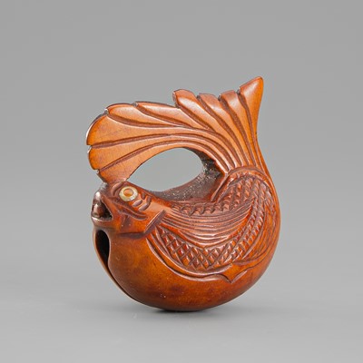 A WOOD NETSUKE OF A FISH MOKUGYO