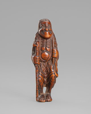 A WOOD NETSUKE OF TEKKAI SENNIN