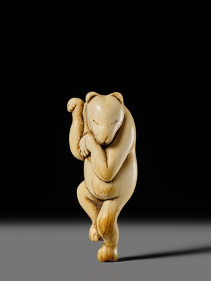 Lot 127 - HIDEMASA: A RARE AND SUPERB IVORY NETSUKE OF A DANCING KITSUNE
