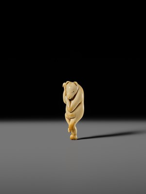 Lot 127 - HIDEMASA: A RARE AND SUPERB IVORY NETSUKE OF A DANCING KITSUNE
