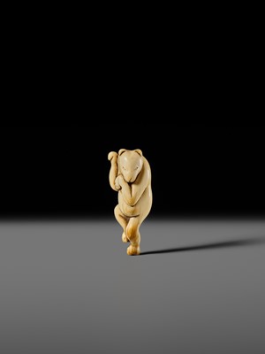 Lot 127 - HIDEMASA: A RARE AND SUPERB IVORY NETSUKE OF A DANCING KITSUNE
