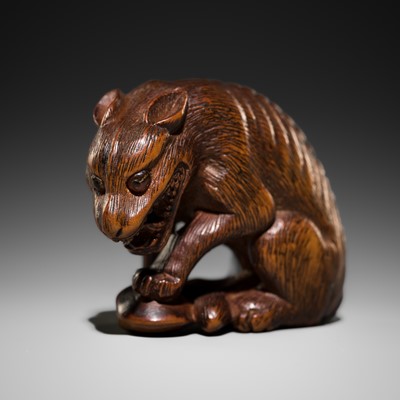 Lot 461 - NAITO TOYOMASA: A WOOD NETSUKE OF A WOLF