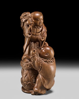 MASATSUGU: A FINE NAGOYA SCHOOL WOOD NETSUKE OF TWO KARAKO AND PEONY