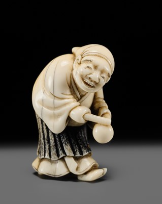 Lot 134 - MAZAKAZU: AN IVORY NETSUKE OF A HACHI-TATAKI PERFORMER