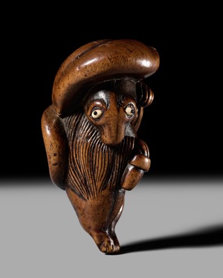Lot 179 - MINKO: AN AMUSING WOOD NETSUKE OF A TANUKI DISGUISED AS A SAKE VENDOR