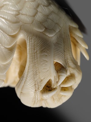 Lot 151 - IKKU: A MASTERFUL IVORY NETSUKE OF AN EAGLE