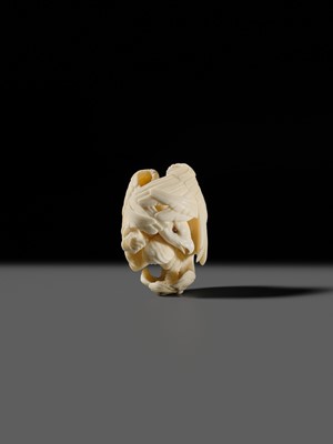 Lot 151 - IKKU: A MASTERFUL IVORY NETSUKE OF AN EAGLE