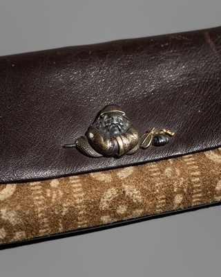 Lot 244 - A LEATHER TABAKO-IRE (POUCH) WITH A MIXED METAL FITTING