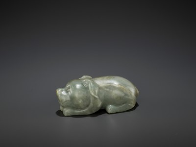 Lot 72 - A CARVED CELADON AND RUSSET JADE FIGURE OF A DOG, LATE MING DYNASTY