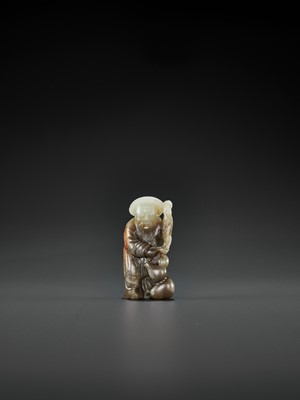 Lot 66 - A PALE CELADON, GRAY AND RUSSET JADE FIGURE OF DONGFANG SHUO, QING DYNASTY